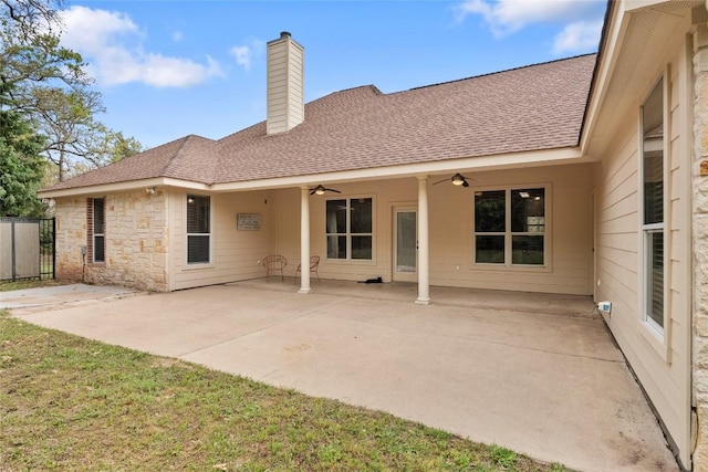 330 Arbors Cir, Elgin, TX 78621 - back of house with a ceiling fan, a chimney, fence, a shingled roof, and a patio area