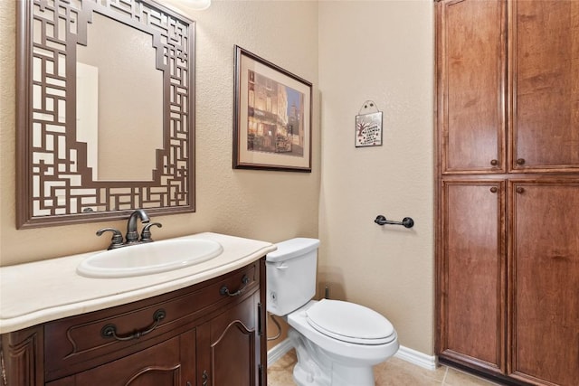 330 Arbors Cir, Elgin, TX 78621 - half bathroom featuring toilet, vanity, tile patterned floors, and baseboards