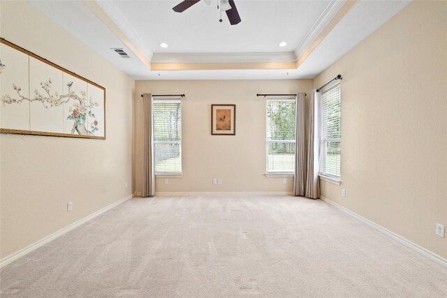 330 Arbors Cir, Elgin, TX 78621 - spare room featuring ornamental molding, a raised ceiling, a ceiling fan, light colored carpet, and baseboards