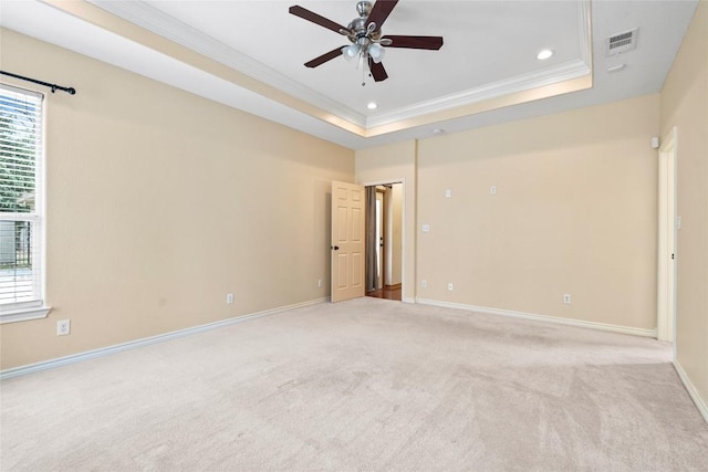 330 Arbors Cir, Elgin, TX 78621 - unfurnished room with ornamental molding, ceiling fan, light colored carpet, a raised ceiling, and recessed lighting