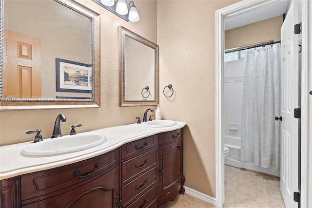 330 Arbors Cir, Elgin, TX 78621 - full bath featuring double vanity, tile patterned flooring, a textured wall, shower / tub combo, and toilet