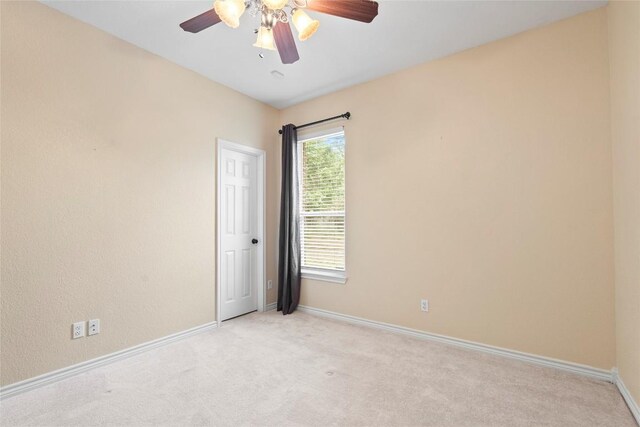 330 Arbors Cir, Elgin, TX 78621 - unfurnished room featuring light colored carpet, baseboards, and ceiling fan