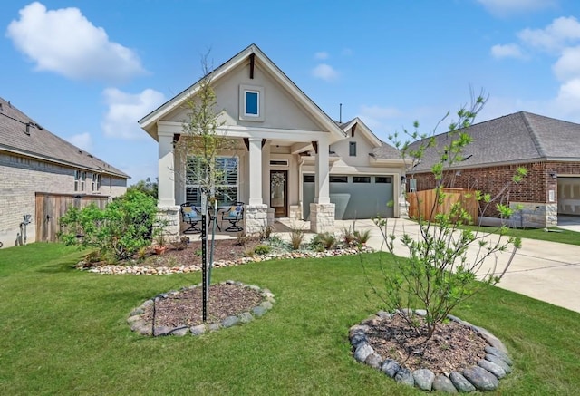 113 Cibolo Creek Loop, Bastrop, TX 78602 - view of front of home with concrete driveway, an attached garage, a porch, and stucco siding