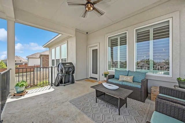 view of patio / terrace featuring grilling area, an outdoor living space, and ceiling fan