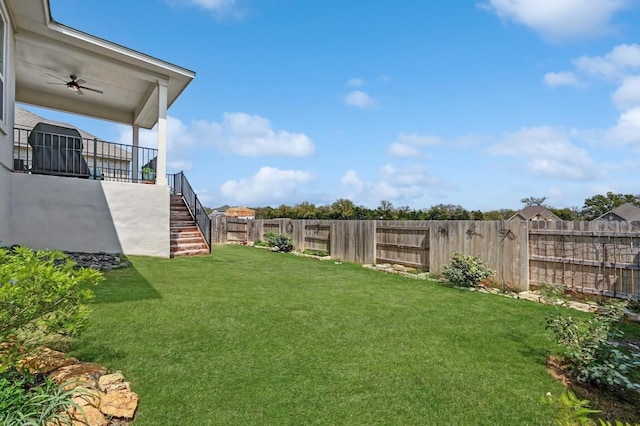 113 Cibolo Creek Loop, Bastrop, TX 78602 - fenced backyard with stairway and ceiling fan