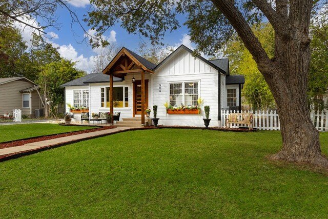 904 Fisher St, Taylor, TX 76574 - view of front of home featuring board and batten siding and roof with shingles