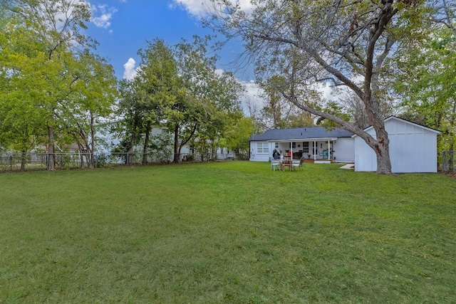 904 Fisher St, Taylor, TX 76574 - fenced backyard featuring a patio area and an outdoor structure