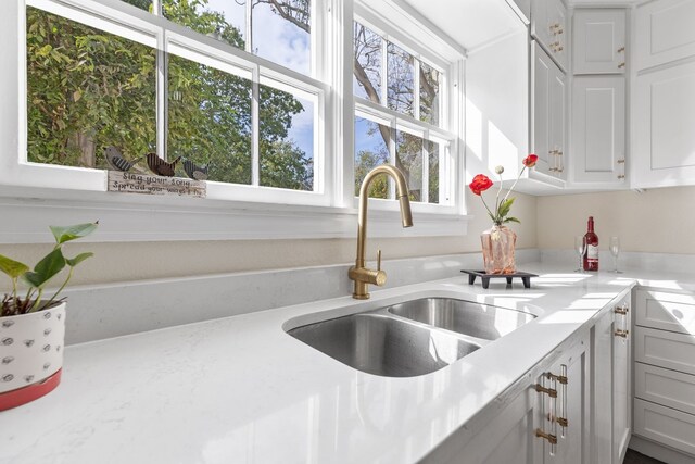 904 Fisher St, Taylor, TX 76574 - kitchen featuring light countertops and white cabinets