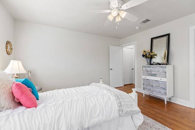 904 Fisher St, Taylor, TX 76574 - bedroom with wood finished floors and a ceiling fan