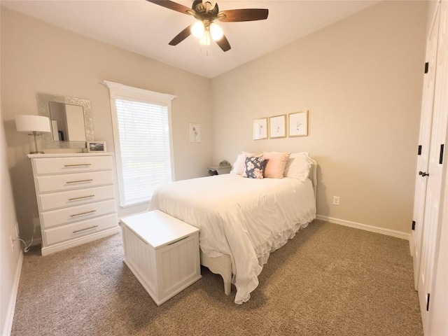 bedroom with baseboards, a ceiling fan, and carpet
