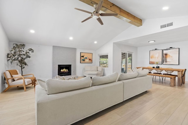 6809 Lunar Dr, Austin, TX 78745 - living room featuring light wood finished floors, a ceiling fan, a fireplace, and recessed lighting