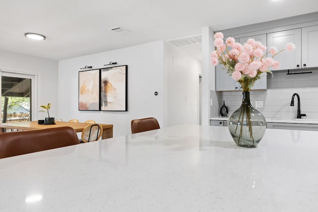 dining space featuring visible vents
