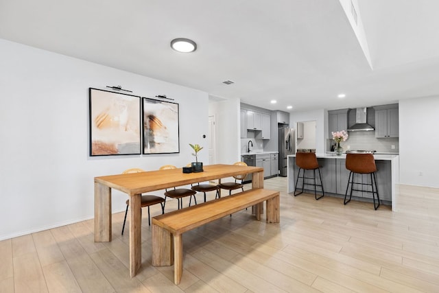 6809 Lunar Dr, Austin, TX 78745 - dining space featuring light wood-type flooring and recessed lighting