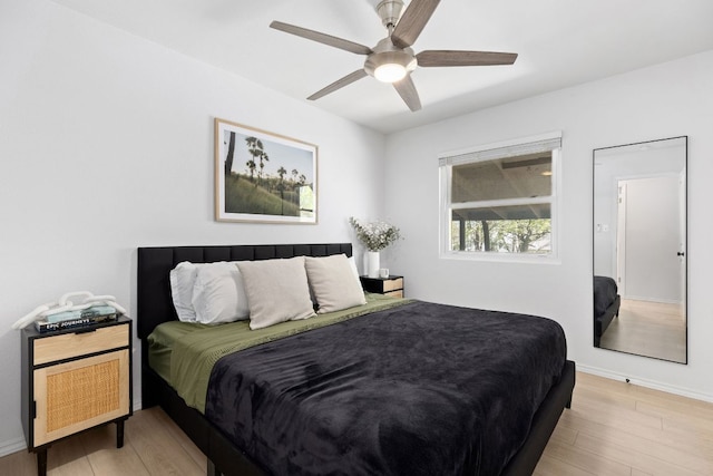 6809 Lunar Dr, Austin, TX 78745 - bedroom featuring light wood finished floors, baseboards, and a ceiling fan