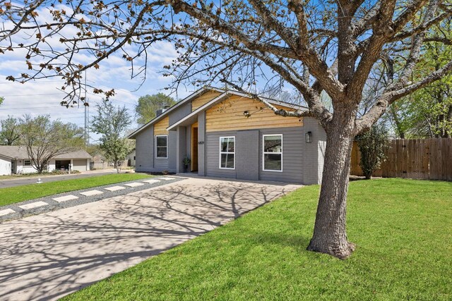 6809 Lunar Dr, Austin, TX 78745 - view of front of property with concrete driveway and brick siding