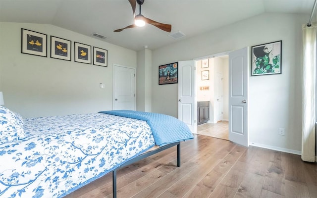 20700 Deep Crk, Lago Vista, TX 78645 - bedroom featuring lofted ceiling, wood finished floors, and a ceiling fan