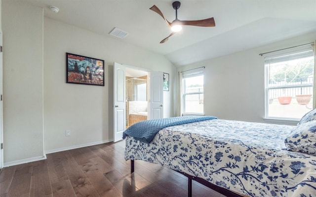 20700 Deep Crk, Lago Vista, TX 78645 - bedroom with wood finished floors, multiple windows, vaulted ceiling, baseboards, and ceiling fan