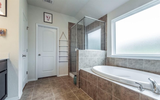20700 Deep Crk, Lago Vista, TX 78645 - bathroom with a bath, a stall shower, vanity, tile patterned flooring, and baseboards
