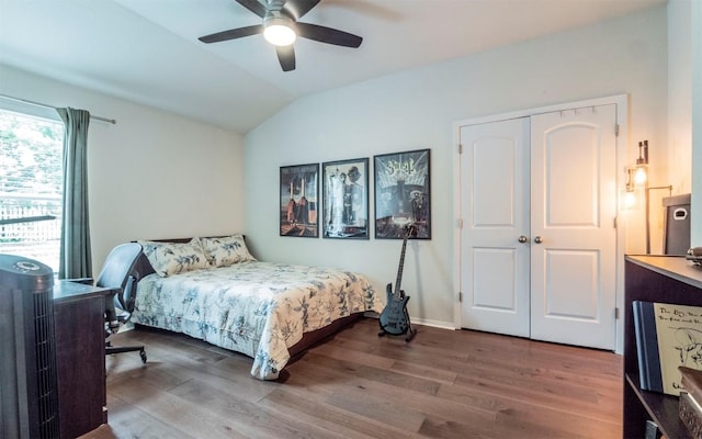 20700 Deep Crk, Lago Vista, TX 78645 - bedroom with vaulted ceiling, wood finished floors, ceiling fan, a closet, and baseboards