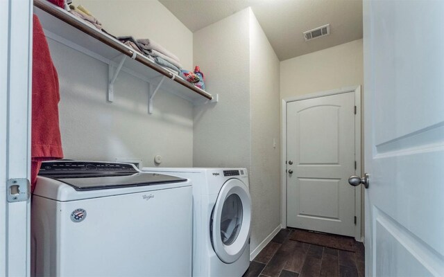 20700 Deep Crk, Lago Vista, TX 78645 - laundry area featuring washing machine and dryer, dark wood-style floors, and baseboards