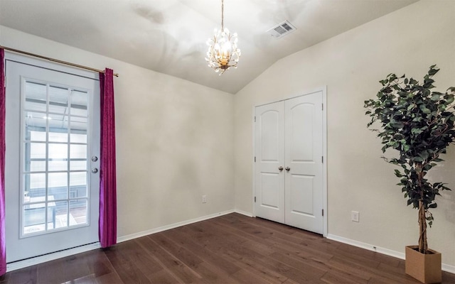 20700 Deep Crk, Lago Vista, TX 78645 - foyer with a chandelier, vaulted ceiling, dark wood-style flooring, and baseboards