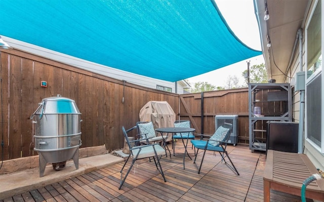 20700 Deep Crk, Lago Vista, TX 78645 - deck featuring central air condition unit and outdoor dining area