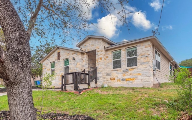 20700 Deep Crk, Lago Vista, TX 78645 - rear view of house featuring a lawn and stone siding