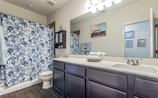 20700 Deep Crk, Lago Vista, TX 78645 - full bathroom featuring vanity, wood finished floors, and shower / bathtub combination with curtain