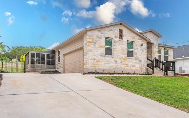 20700 Deep Crk, Lago Vista, TX 78645 - view of property exterior featuring driveway, a garage, stone siding, and a sunroom