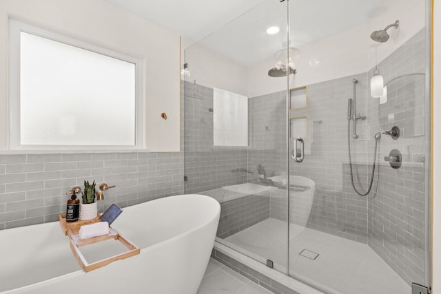 4004 Cloudy Ridge Rd, Austin, TX 78734 - full bath featuring a stall shower, a freestanding bath, tile walls, and recessed lighting