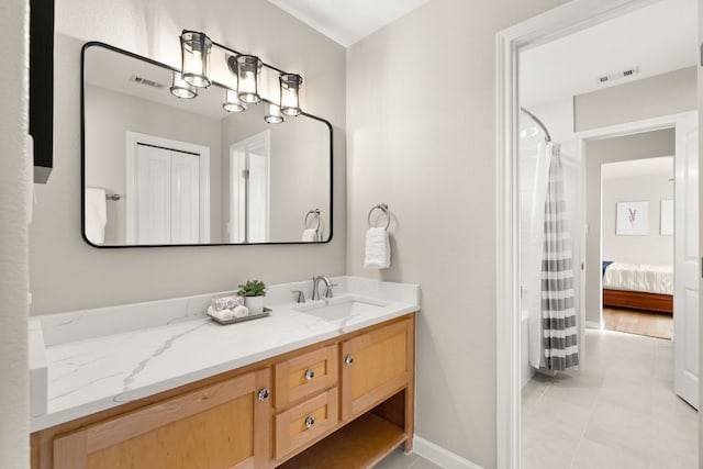4004 Cloudy Ridge Rd, Austin, TX 78734 - bathroom with vanity, tile patterned floors, and baseboards