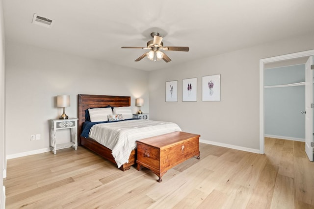 4004 Cloudy Ridge Rd, Austin, TX 78734 - bedroom featuring light wood finished floors, a ceiling fan, and a walk in closet