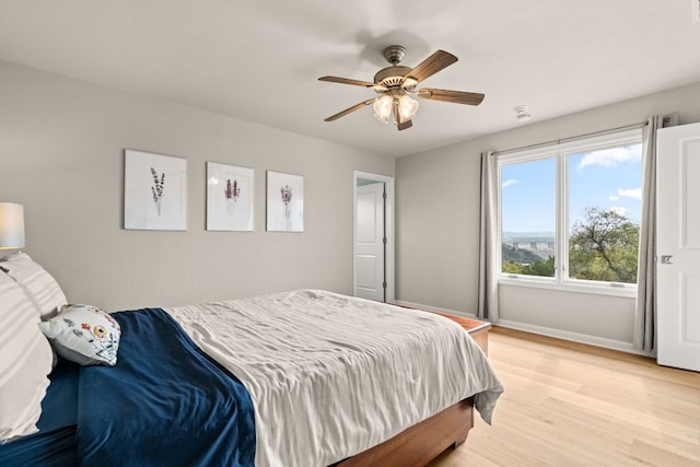 4004 Cloudy Ridge Rd, Austin, TX 78734 - bedroom with light wood-type flooring, baseboards, and ceiling fan