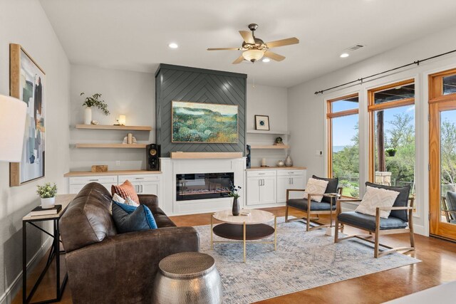 4004 Cloudy Ridge Rd, Austin, TX 78734 - living room featuring ceiling fan, a glass covered fireplace, and recessed lighting