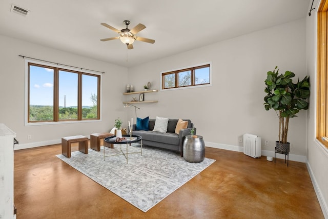 4004 Cloudy Ridge Rd, Austin, TX 78734 - living room with finished concrete floors, ceiling fan, and healthy amount of natural light