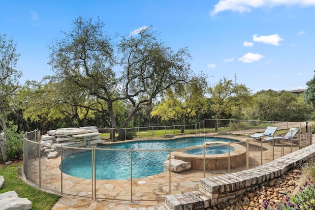 4004 Cloudy Ridge Rd, Austin, TX 78734 - view of swimming pool with a pool with connected hot tub and view of scattered trees
