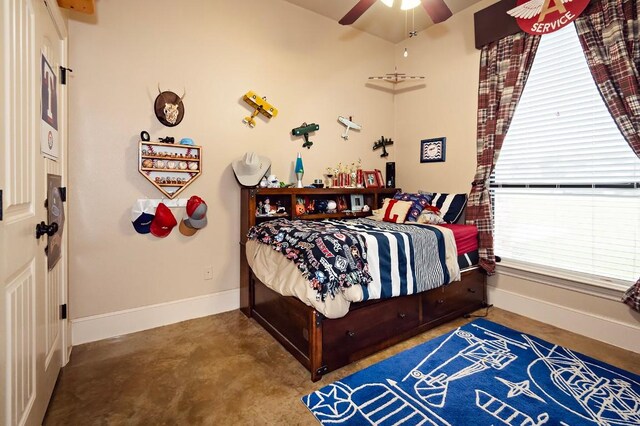 2129 Woodland Bend Rd, Salado, TX 76571 - bedroom with baseboards, concrete floors, and ceiling fan