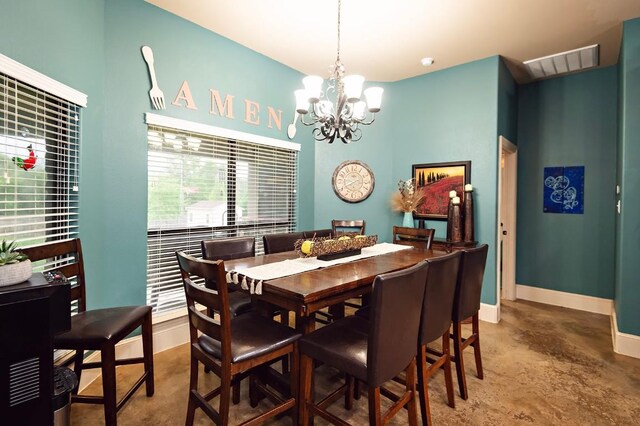 2129 Woodland Bend Rd, Salado, TX 76571 - dining room featuring baseboards, concrete floors, visible vents, and an inviting chandelier