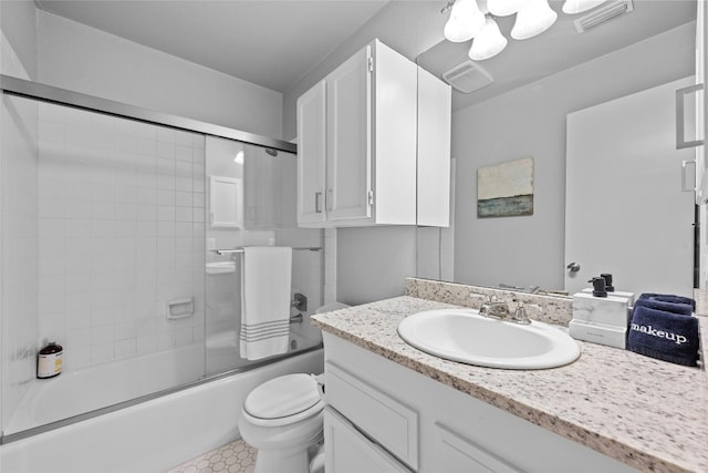 1406 Windsor Rd Unit 301, Austin, TX 78703 - full bath with visible vents, toilet, vanity, and enclosed tub / shower combo