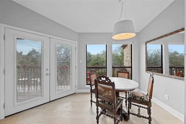 1406 Windsor Rd Unit 301, Austin, TX 78703 - dining room featuring baseboards, french doors, and light wood-style floors