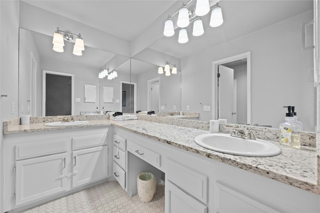 1406 Windsor Rd Unit 301, Austin, TX 78703 - full bathroom featuring double vanity, a sink, an inviting chandelier, and tile patterned floors