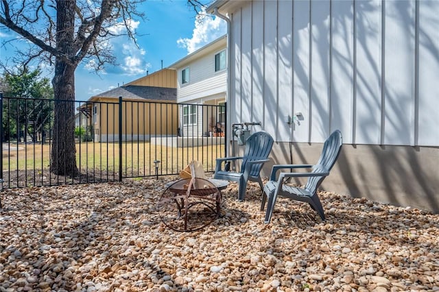 view of yard featuring a fire pit and fence
