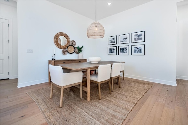 dining area featuring recessed lighting, baseboards, and light wood-type flooring