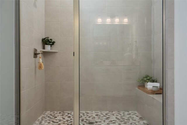 bathroom with a shower stall