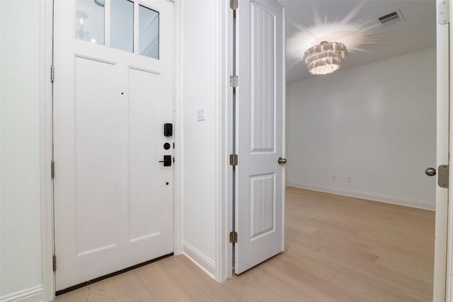 6108 Whipple Way, Austin, TX 78745 - foyer featuring light wood-style floors and baseboards