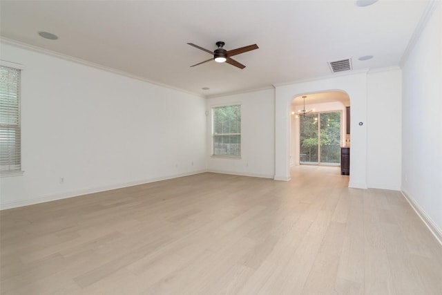 6108 Whipple Way, Austin, TX 78745 - spare room with a ceiling fan, light wood-style floors, ornamental molding, arched walkways, and a chandelier