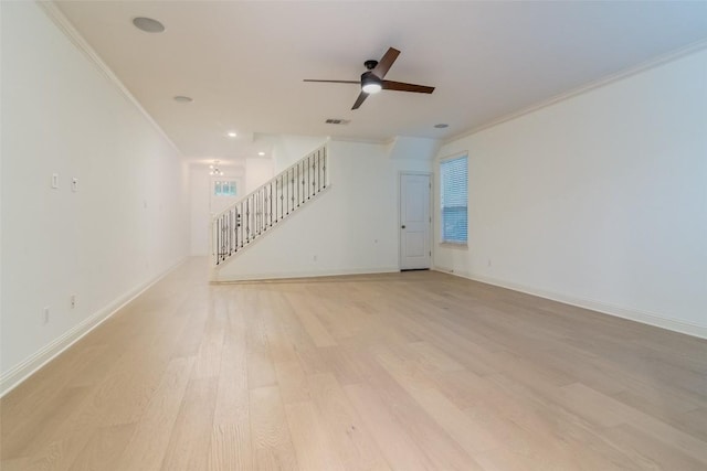6108 Whipple Way, Austin, TX 78745 - unfurnished room with stairs, crown molding, a ceiling fan, and light wood-style floors