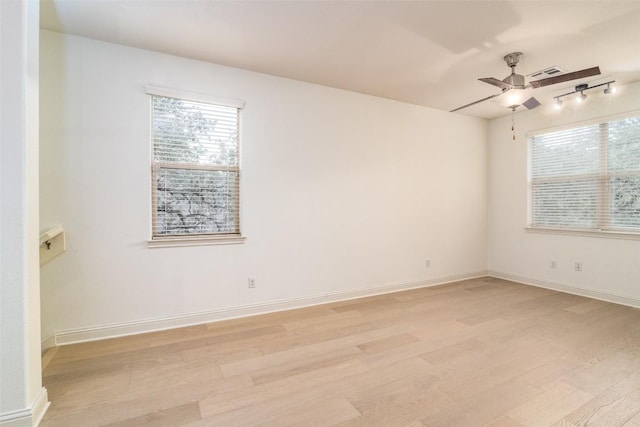 6108 Whipple Way, Austin, TX 78745 - spare room with light wood-style flooring, a ceiling fan, healthy amount of natural light, and track lighting