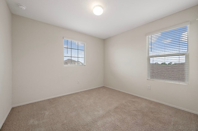 3603 Canaan Matthew Dr, Austin, TX 78725 - carpeted spare room with plenty of natural light and a smoke detector