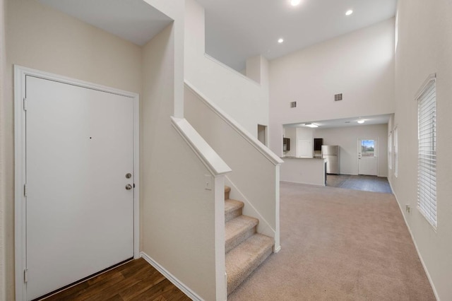 3603 Canaan Matthew Dr, Austin, TX 78725 - entrance foyer featuring stairway, recessed lighting, and a towering ceiling